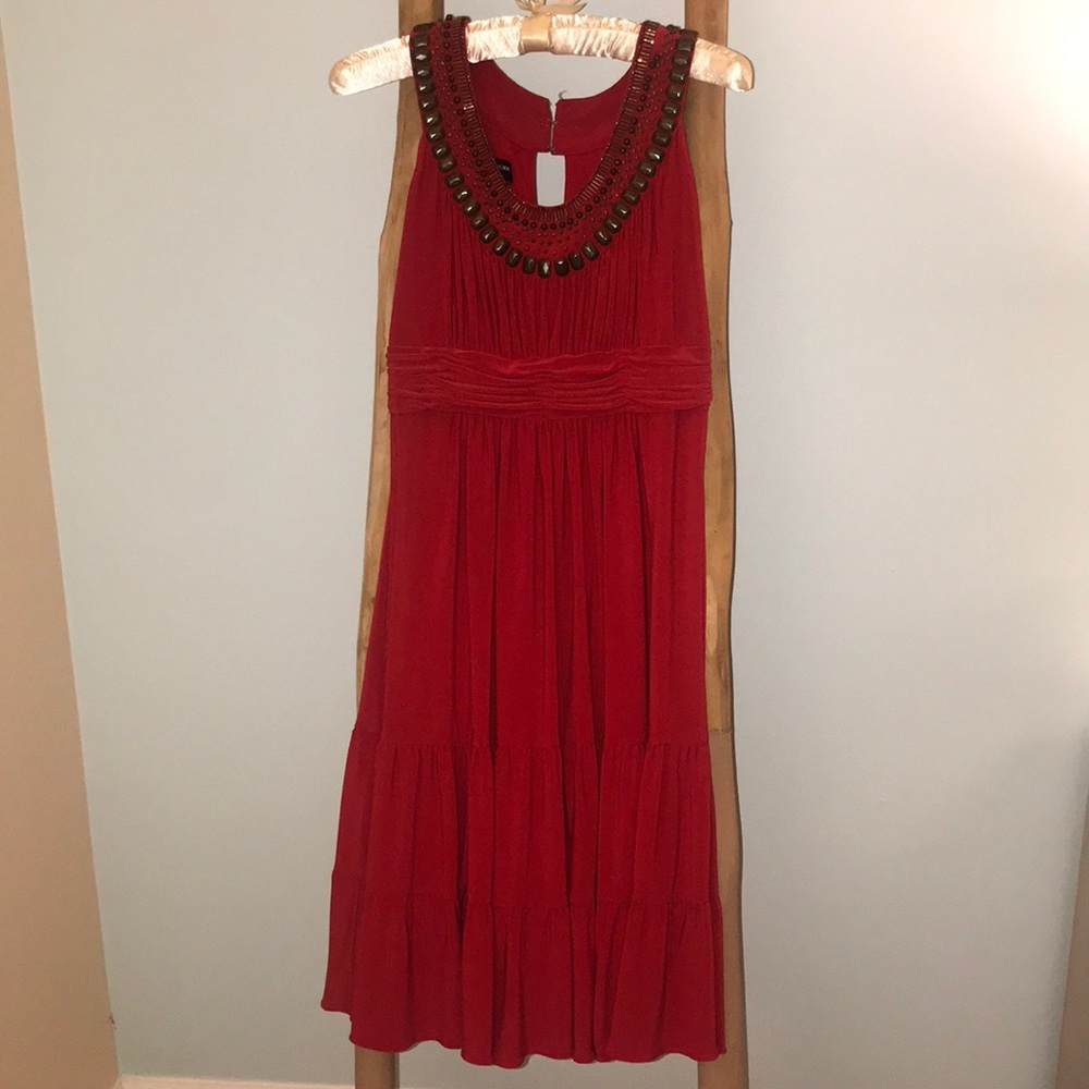 Orangish red dress with bronze jewels